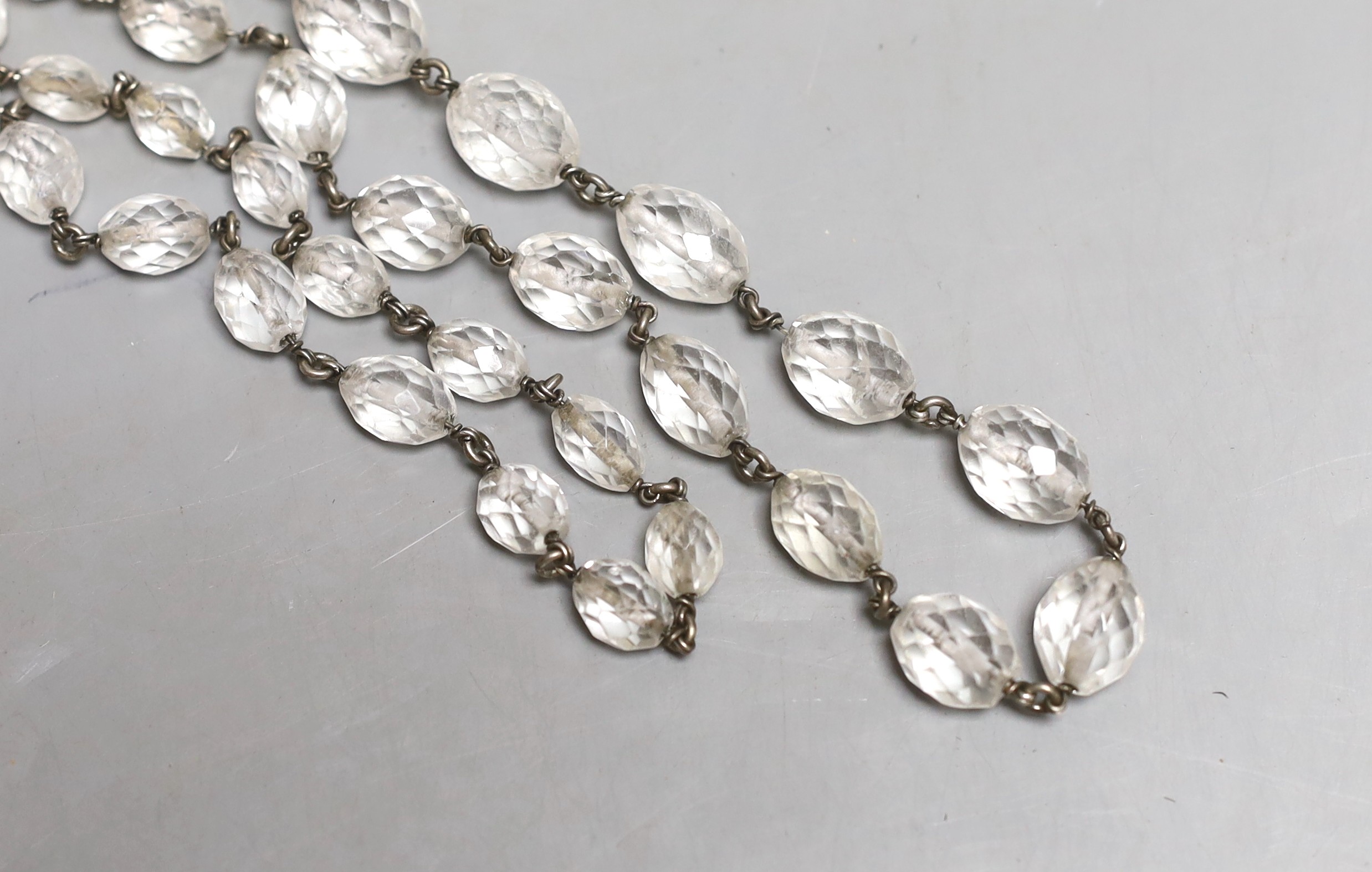A white metal and facetted rock crystal necklace, 138cm.